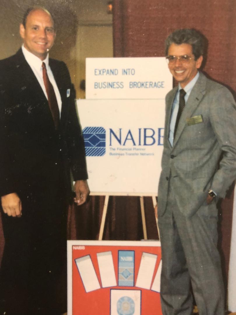Frank Covich with James Wisner, President of Financial Service Corporation, 1986